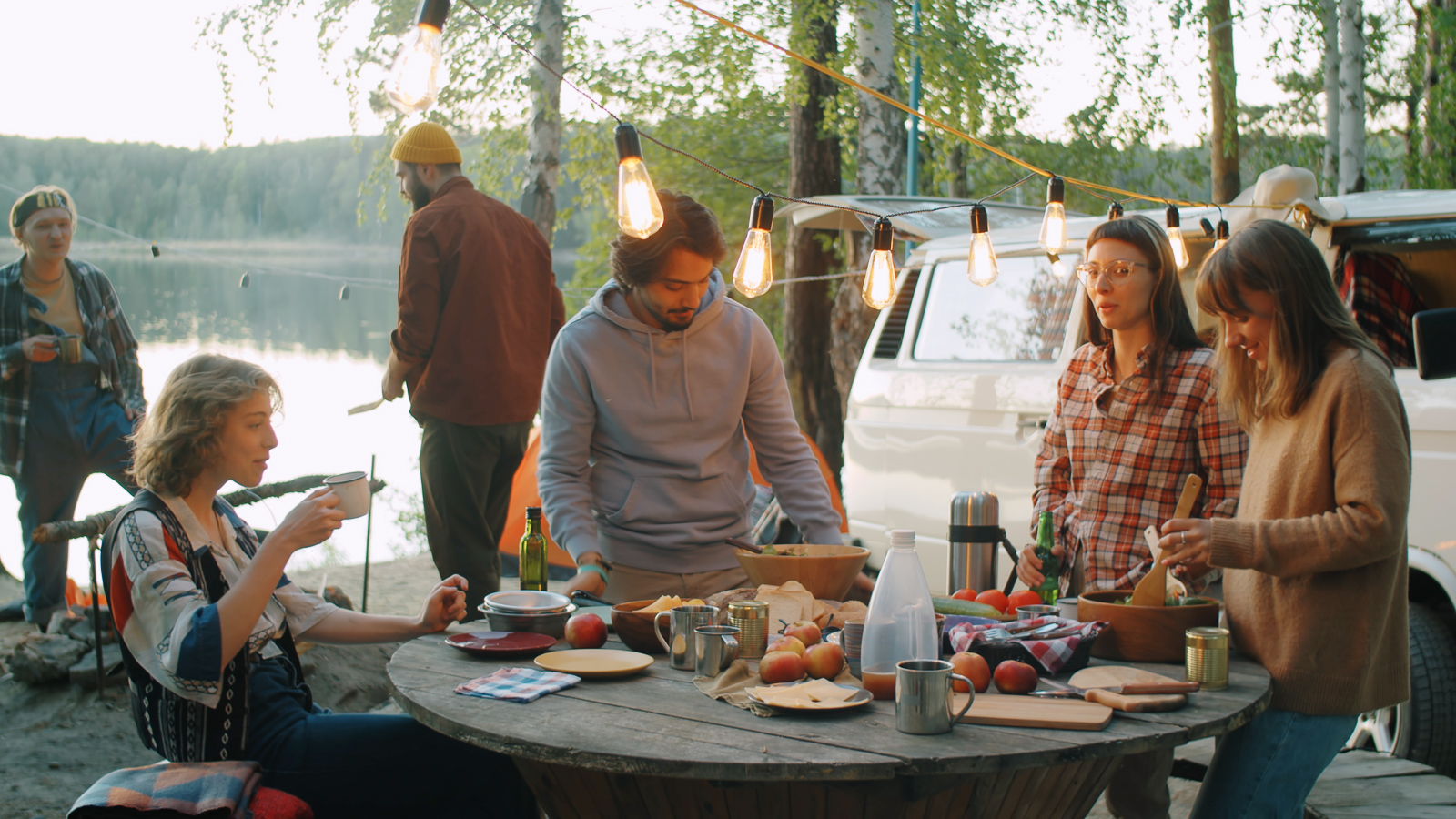 Friends sitting down to an outdoor dinner